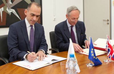 Harris Georgiades and Matthew Kidd sign the double taxation agreement in Nicosia