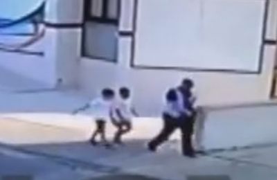 Suspect caught on tape walking with the two boys, appears to be coaxing them into following him