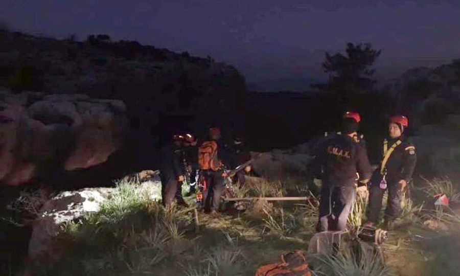 Young man dies after car plunges off cliff (photos)