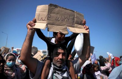 Thousands protest after Greek refugee camp burns down