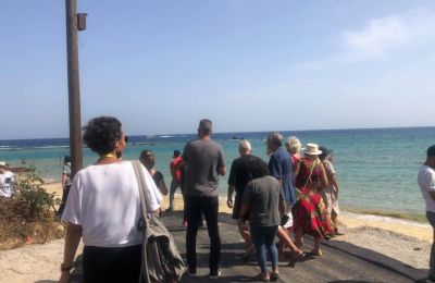 Civilians walk to Varosha beach strip