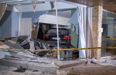 Footballer crashes car into rental dealership