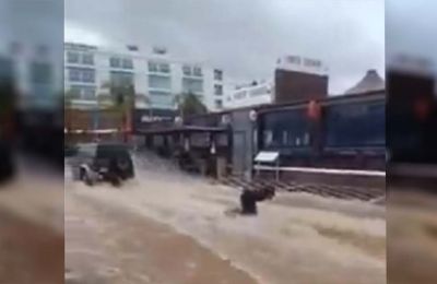 Surfer daredevils spread laughter in flooded Cyprus