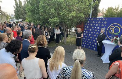 Photos by Costa Constanti.  Ambassador Fiona McKergow delivering her speech at the Australian Embassy reception in Nicosia with Kyriacos Kouros standing next to her.