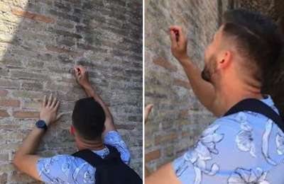 Tourist carves names on Colosseum