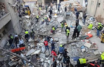 Rescuers search for victims in the aftermath of an Israeli airstrike in Beirut. Pic: AP/Hassan Ammar - Sky News