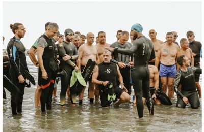 Participants gather to swim and march in solidarity, spreading hope and support for children battling cancer. Credit 'Little Heroes' Facebook