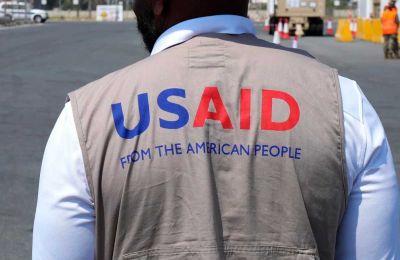 USAID worker in the Port of Larnaca.  Photo Credit: AP News - Petros Karadjias