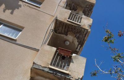 Crumbling balconies and falling debris spark safety concerns