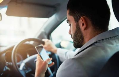 Autocorrect won’t fix a crash. New laws aim to create safer roads. Photo credit: Unsplash