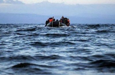 Migrants transferred to reception center as police investigate smuggling operation. File photo