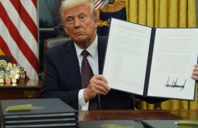 File photo of US President Donald Trump signing an executive order after he took office at the beginning of this year.