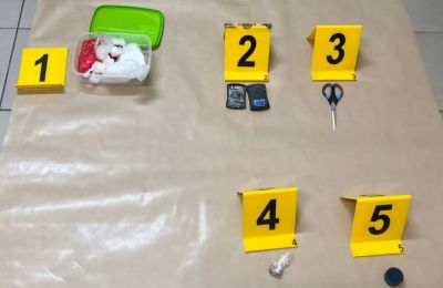 Drug Enforcement Unit seizes cocaine, cannabis, and cash hidden in bathroom fixture.