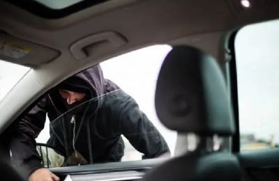 Suspect accused of stealing cash, cards, and documents from parked car. Photo credit: Unsplash