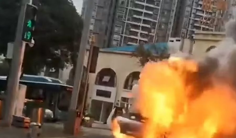 A Taycan EV that burst into flames on the street in Chongqing, southwestern China, during heavy rush hour traffic in September 2023, courtesy AisaWire