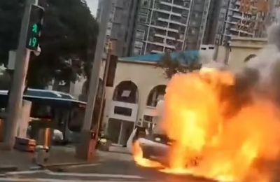 A Taycan EV that burst into flames on the street in Chongqing, southwestern China, during heavy rush hour traffic in September 2023, courtesy AisaWire