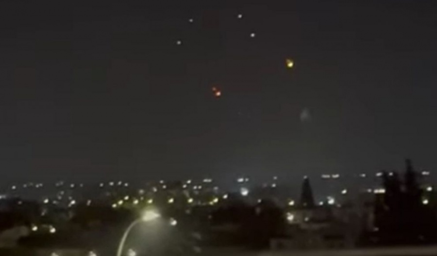 Israel urges civilians to seek shelter as missiles fired from Iran light up skies visible from Cyprus.