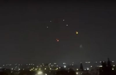 Israel urges civilians to seek shelter as missiles fired from Iran light up skies visible from Cyprus.