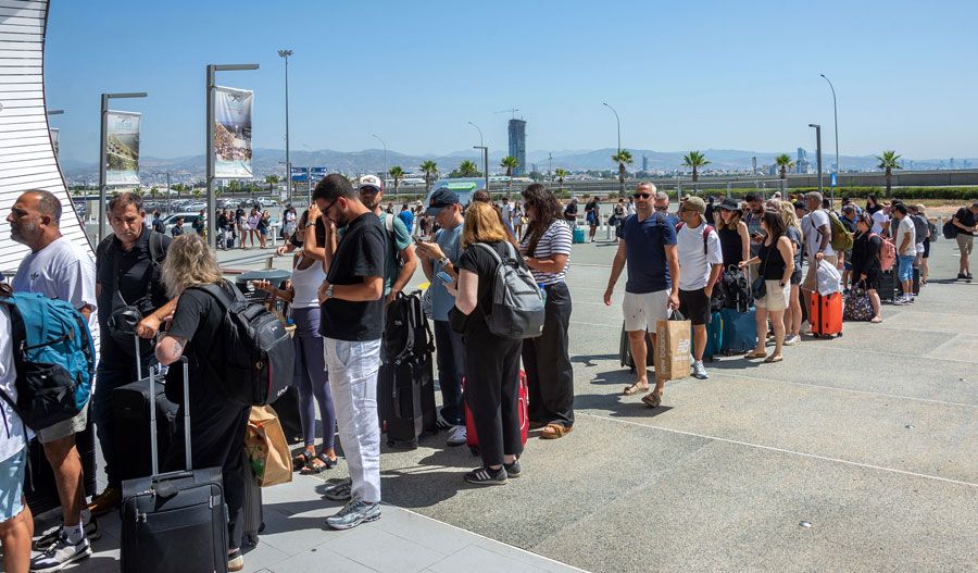 Israelis in Limassol waiting to board cruise ship that will take them to Haifa.