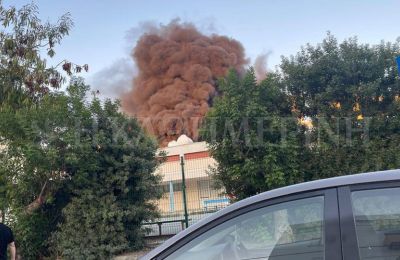 Smoke billows from Lycavittos Elementary School in Nicosia during a fire in a construction area.