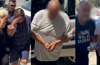 Held over a blue envelope: Five Greek Cypriots face 'court' in occupied north