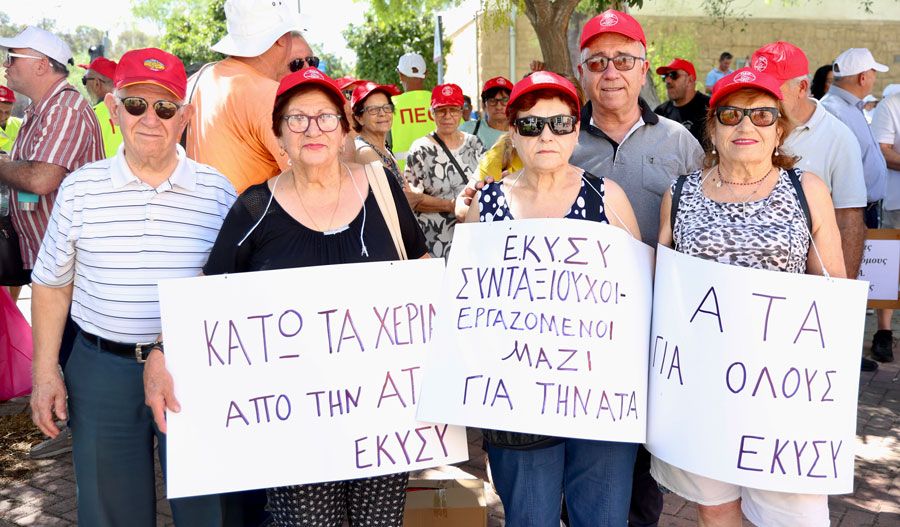 Workers unite in Nicosia to defend automatic cost-of-living adjustment, urging government action. Photos by Philippos Christou