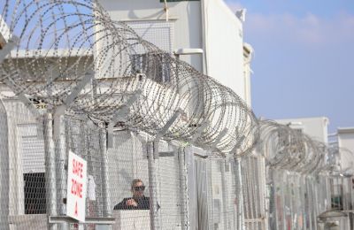 Police detain 16 migrants, arrest 9 in human trafficking bust