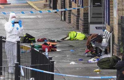 Early evidence points to an “isolated attack” as emergency crews treat victims and major rail disruptions continue through the weekend. Photo screen captured from The Guardian video