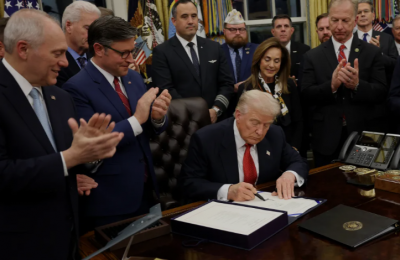 Trump signing the bill to end the longest US government shutdown in history - AP News photo