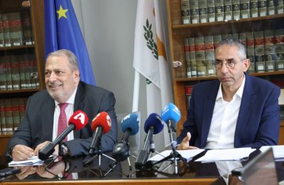 File photo of Assistant Attorney General Savvas Angelides on the right, sitting next to Attorney General George Savvides on the left.