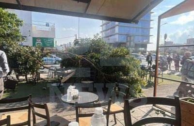 Car crashes into Latsia cafe, uproots tree and injures three