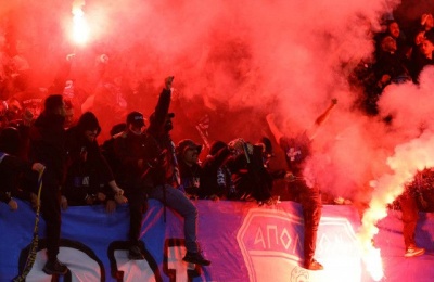 Two officers injured as suspects resist arrest; authorities seize explosives and cannabis-related items.