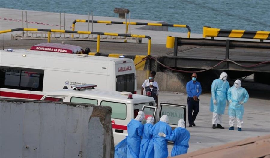 Healthcare personnel wearing protective gear transport patients from the MV Hondius cruise ship to the port of Praia, Cape Verde.
