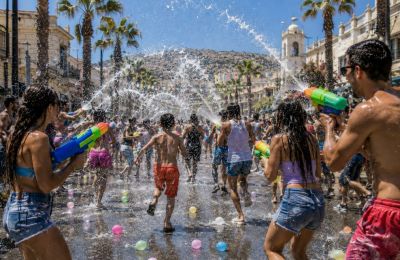 During this long holiday weekend of water, family and tradition, only a few afternoon clouds threaten to make a splash. Image is AI