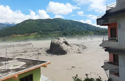 screen grab, nepal flood boulder