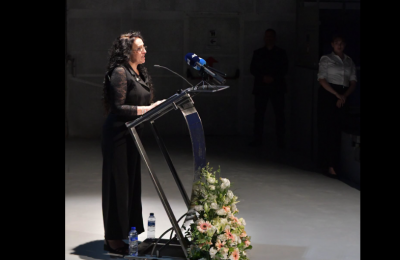 Meirav Leshem Gonen speaking at the October 7th memorial held at the Melina Mercouri Hall on September 30, 2026.